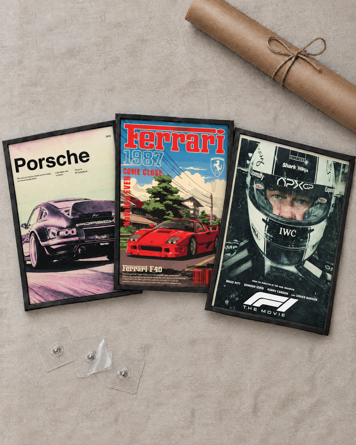 Flat lay of the 3 framed posters with free adhesive wall nails