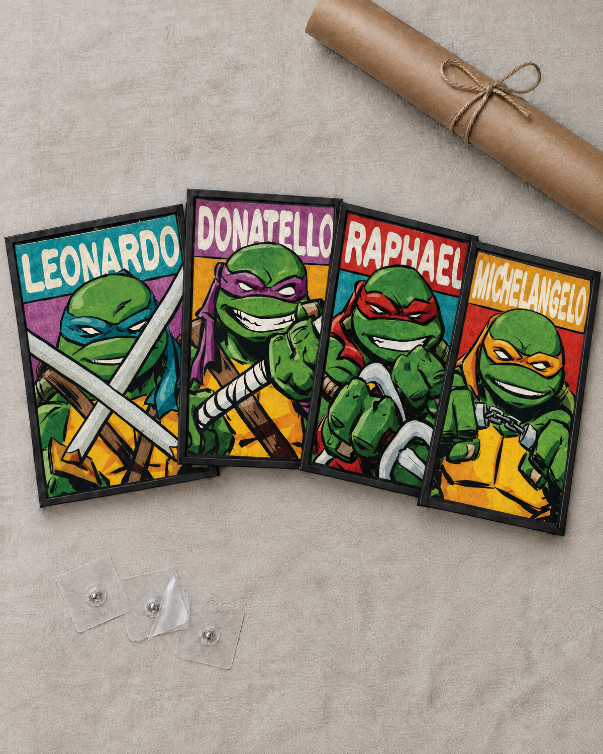 Flat lay of the 4 framed posters with free adhesive wall nails